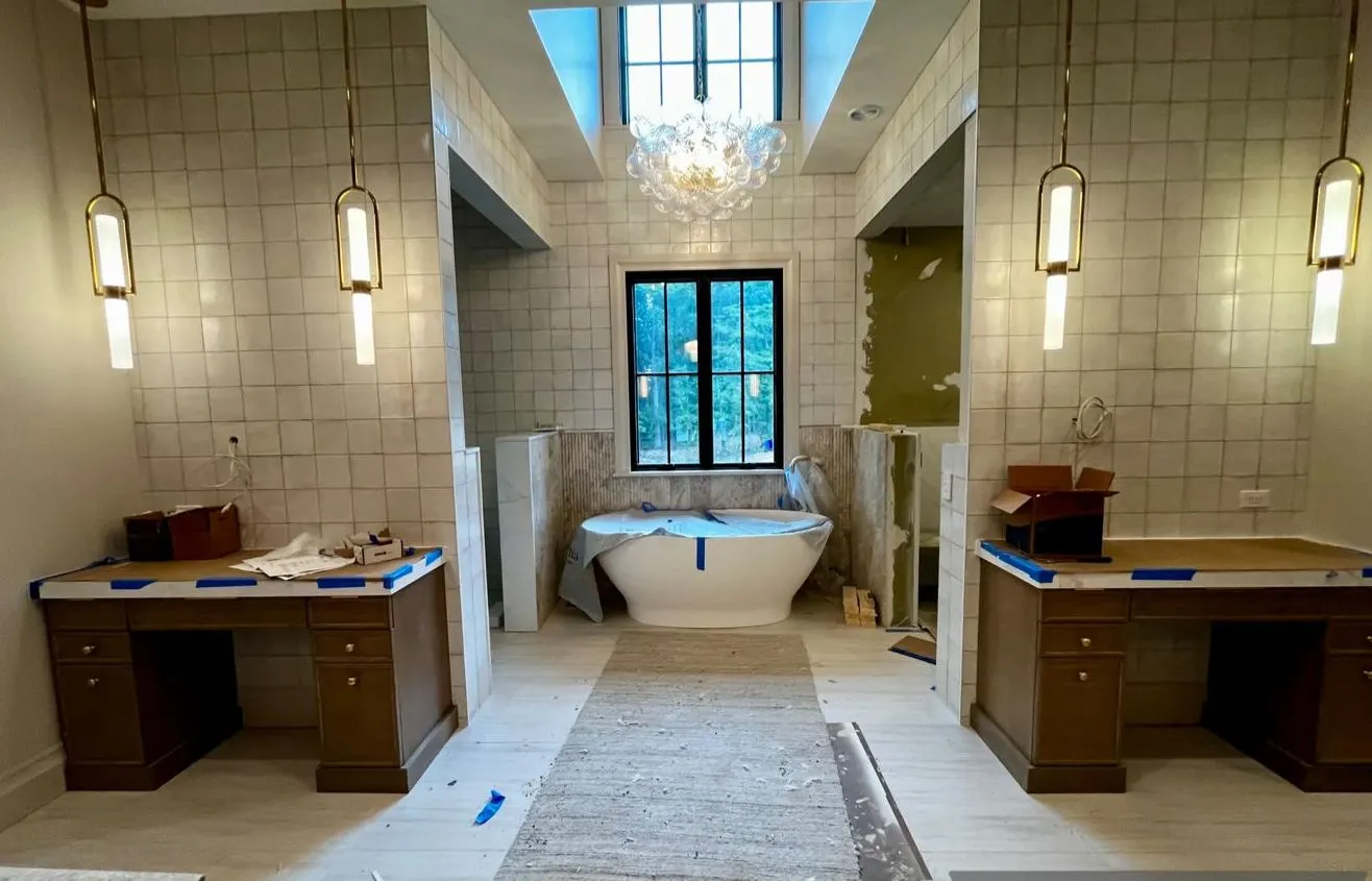 Bathroom with paper runners and construction mess