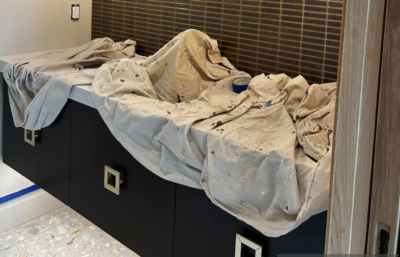 Vanity under dusty drop cloths